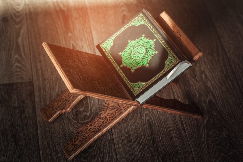 the holy book of the koran on the stand 2021 12 22 18 48 18 utc min